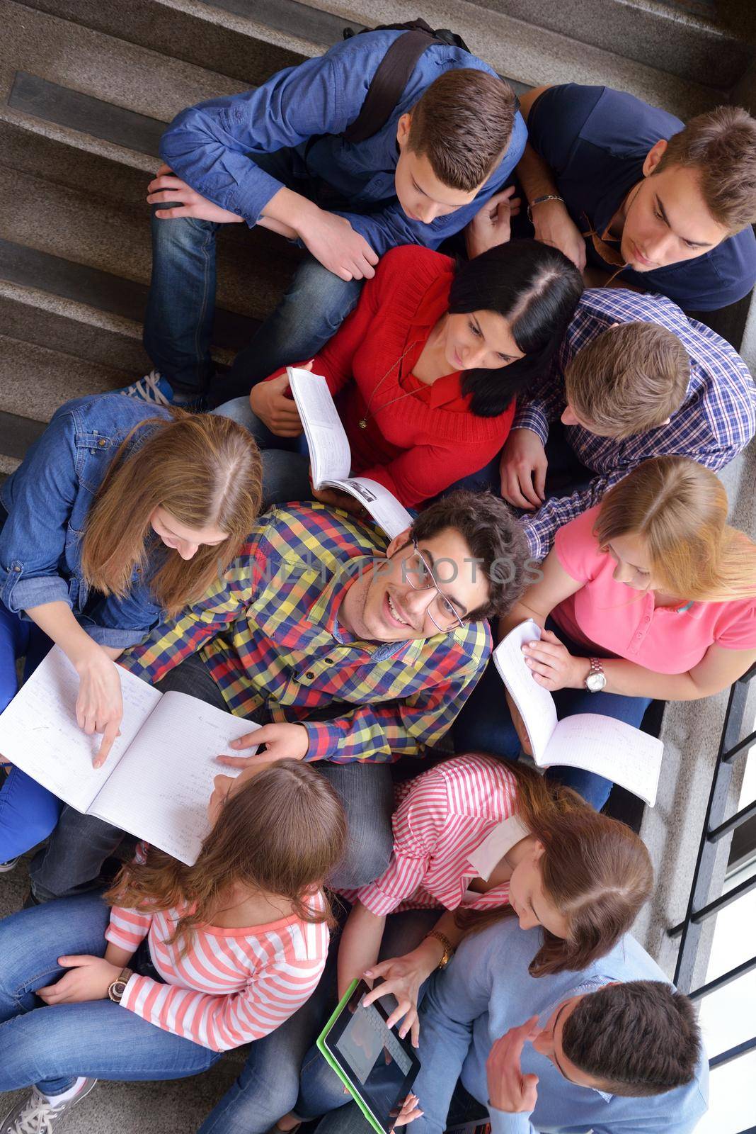 happy teens group in school by dotshock