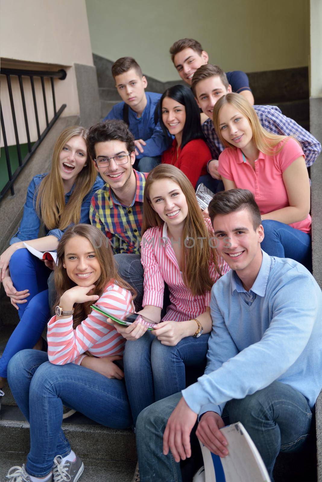 happy teens group in school by dotshock