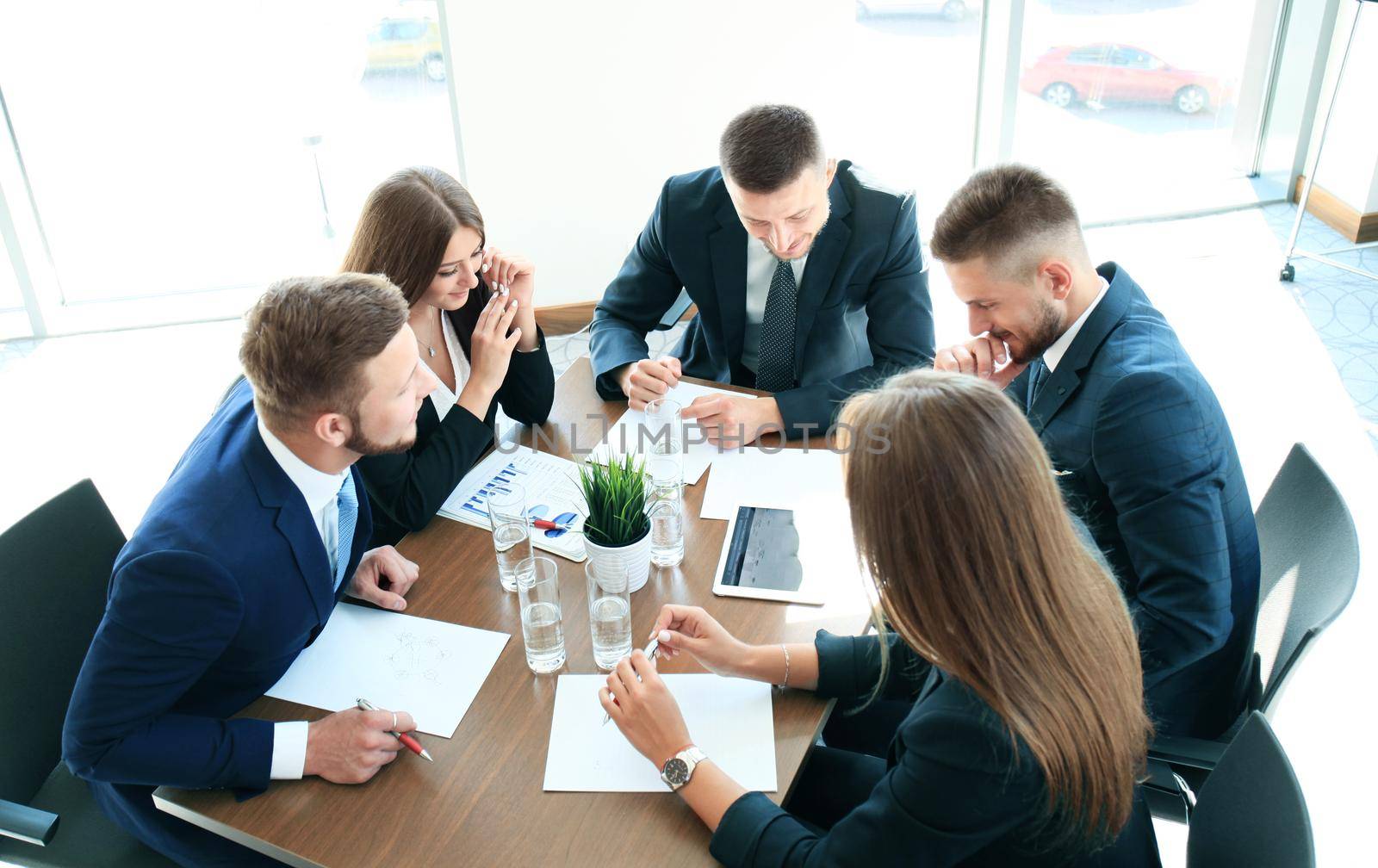 startup business team on meeting in modern bright office interior brainstorming, working on laptop and tablet computer