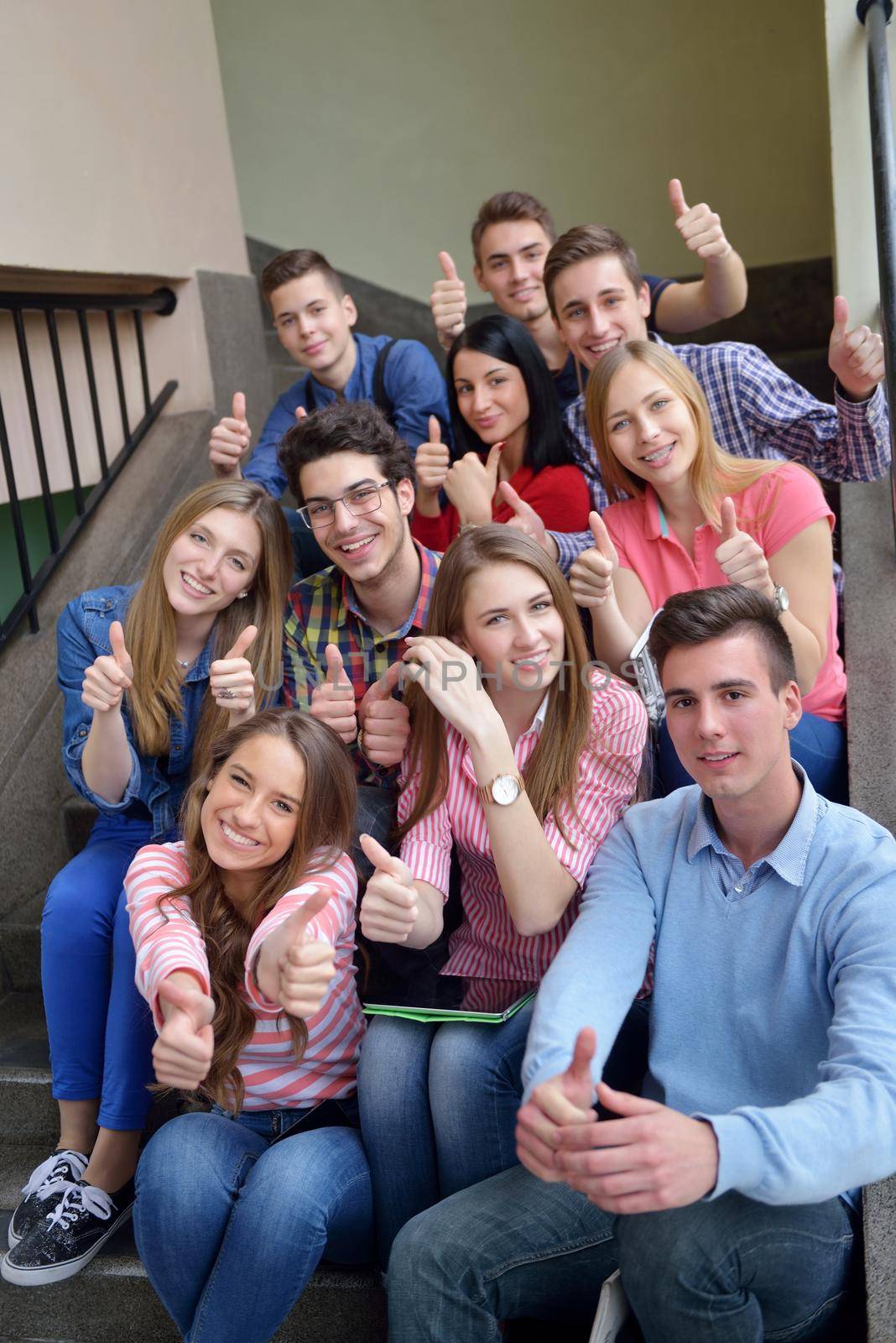 happy teens group in school by dotshock