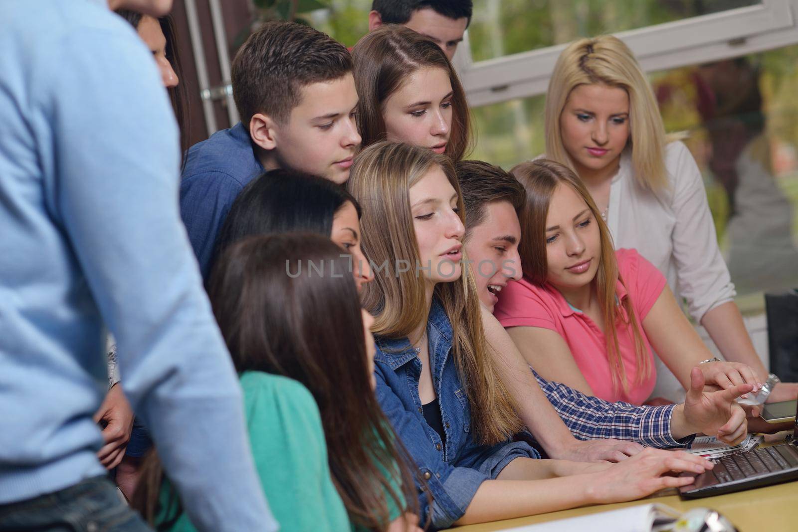 happy teens group in school by dotshock