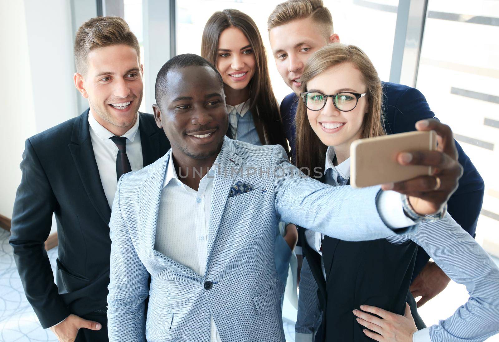 People taking selfie at business meeting