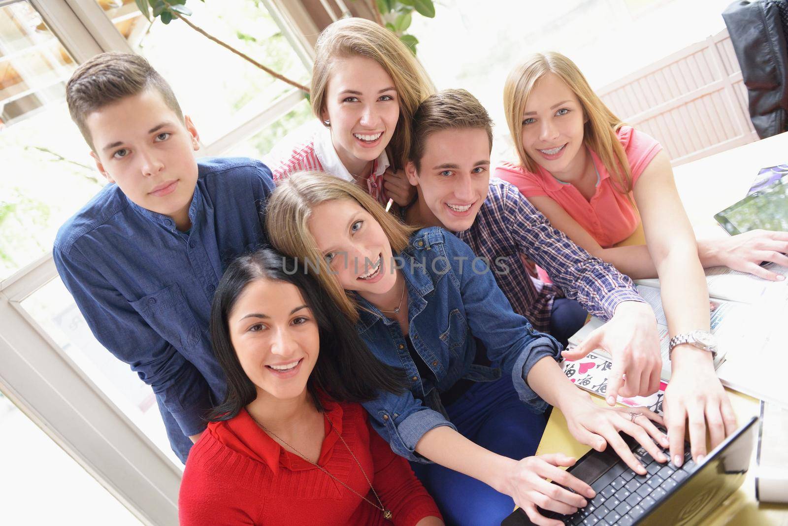 happy teens group in school by dotshock