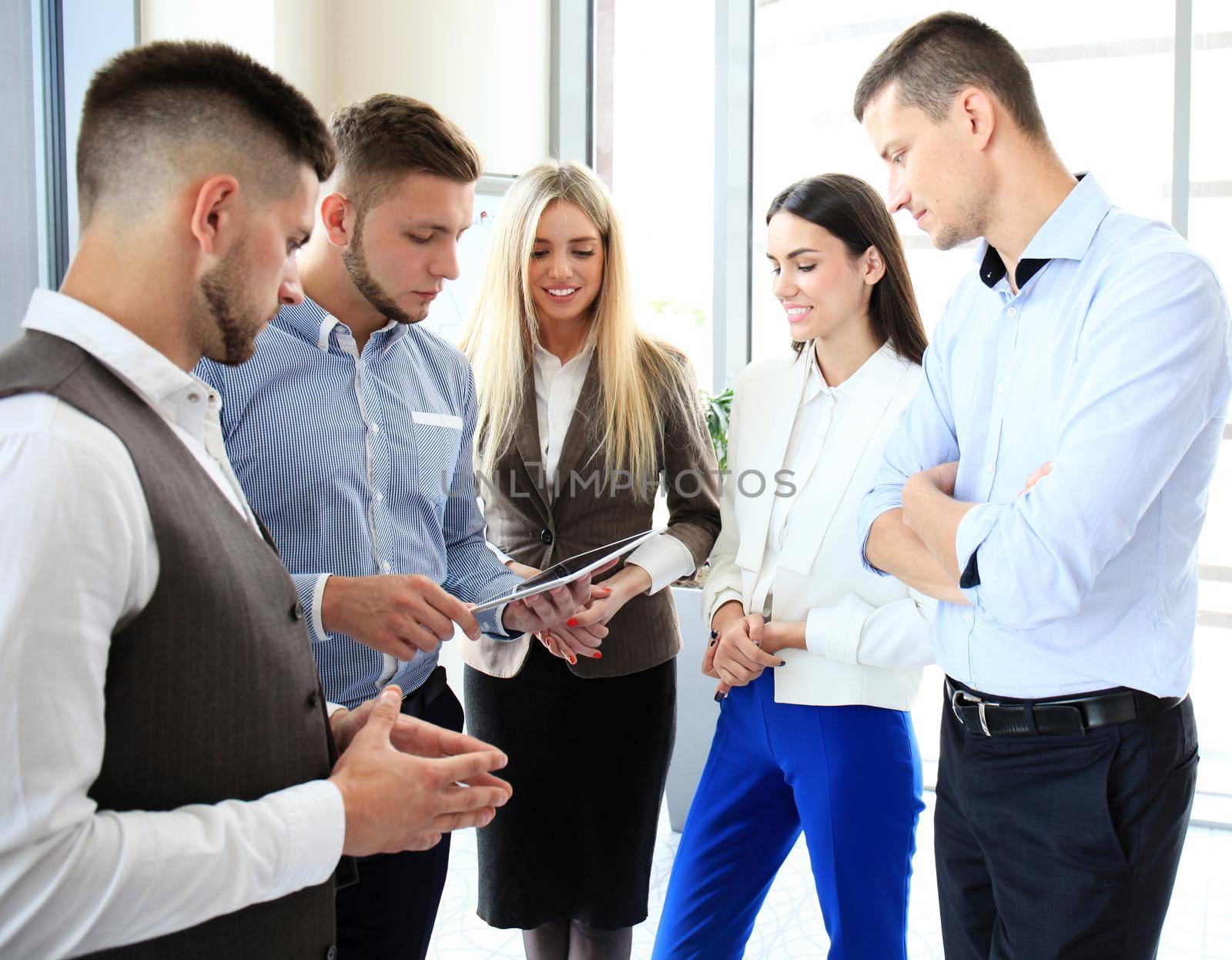 Group of buisness people working on tablet