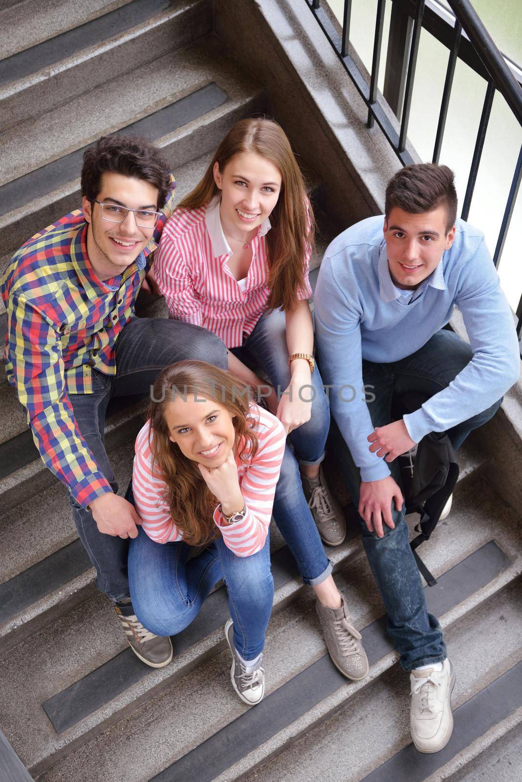 happy teens group in school by dotshock