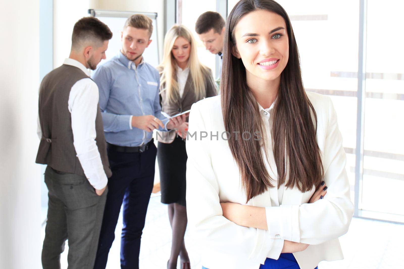 Face of beautiful woman on the background of business people