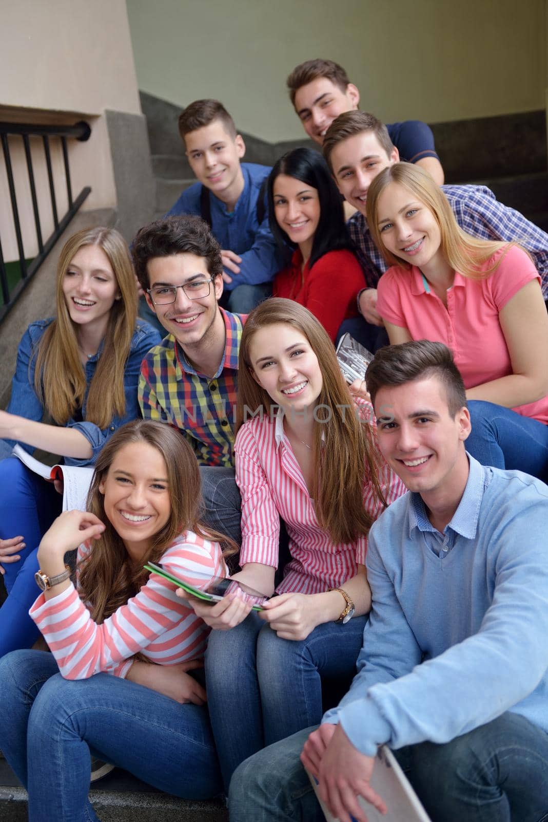 happy teens group in school by dotshock