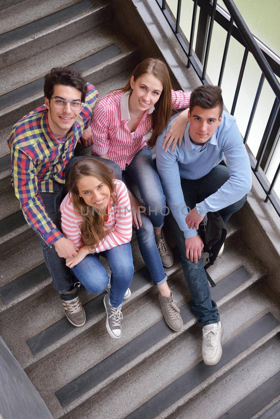 happy teens group in school by dotshock