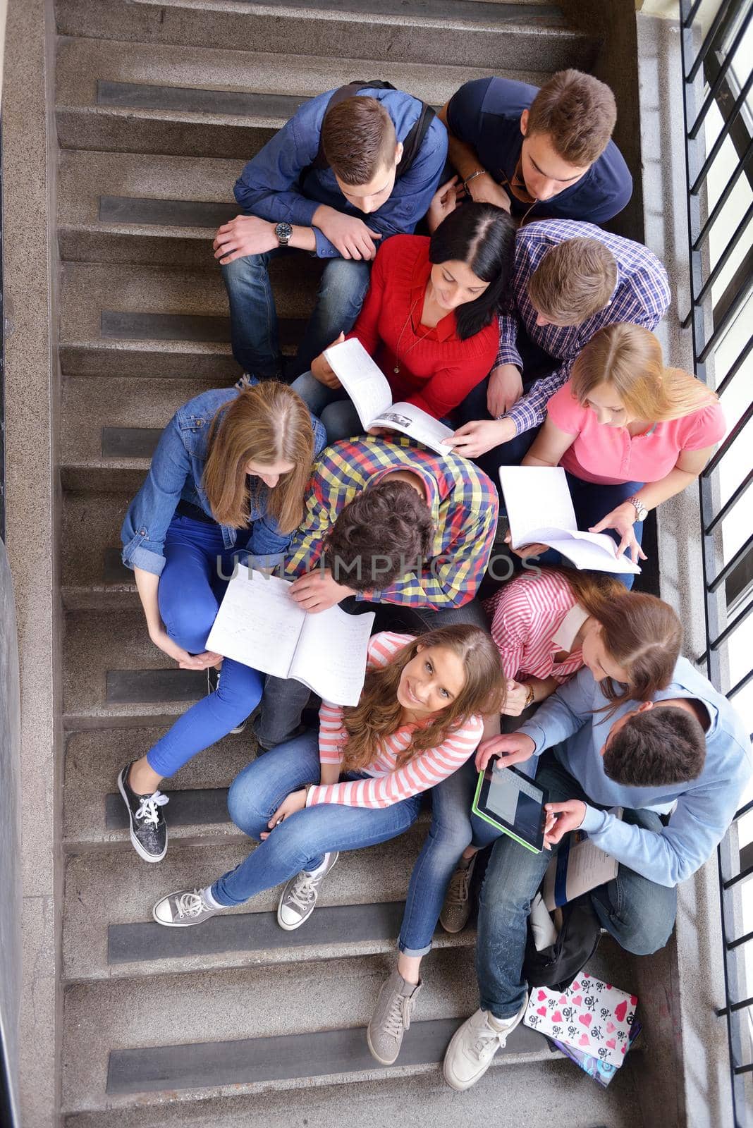 happy teens group in school by dotshock