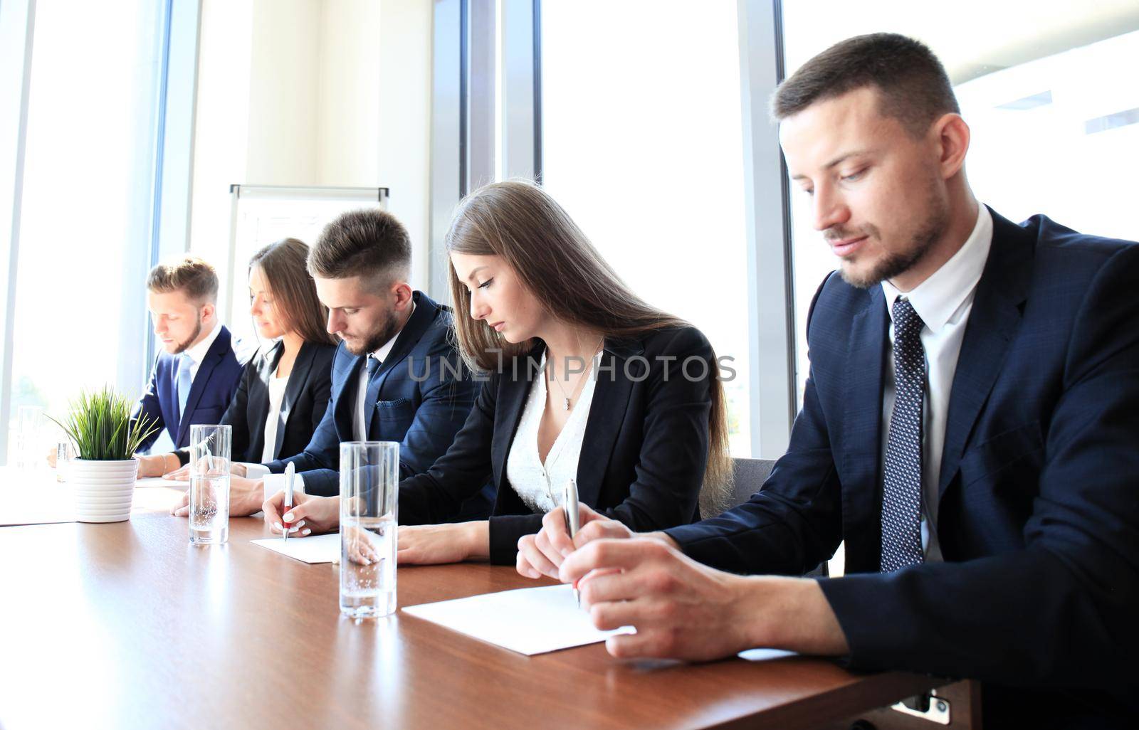 Image of row of business people working at seminar by tsyhun