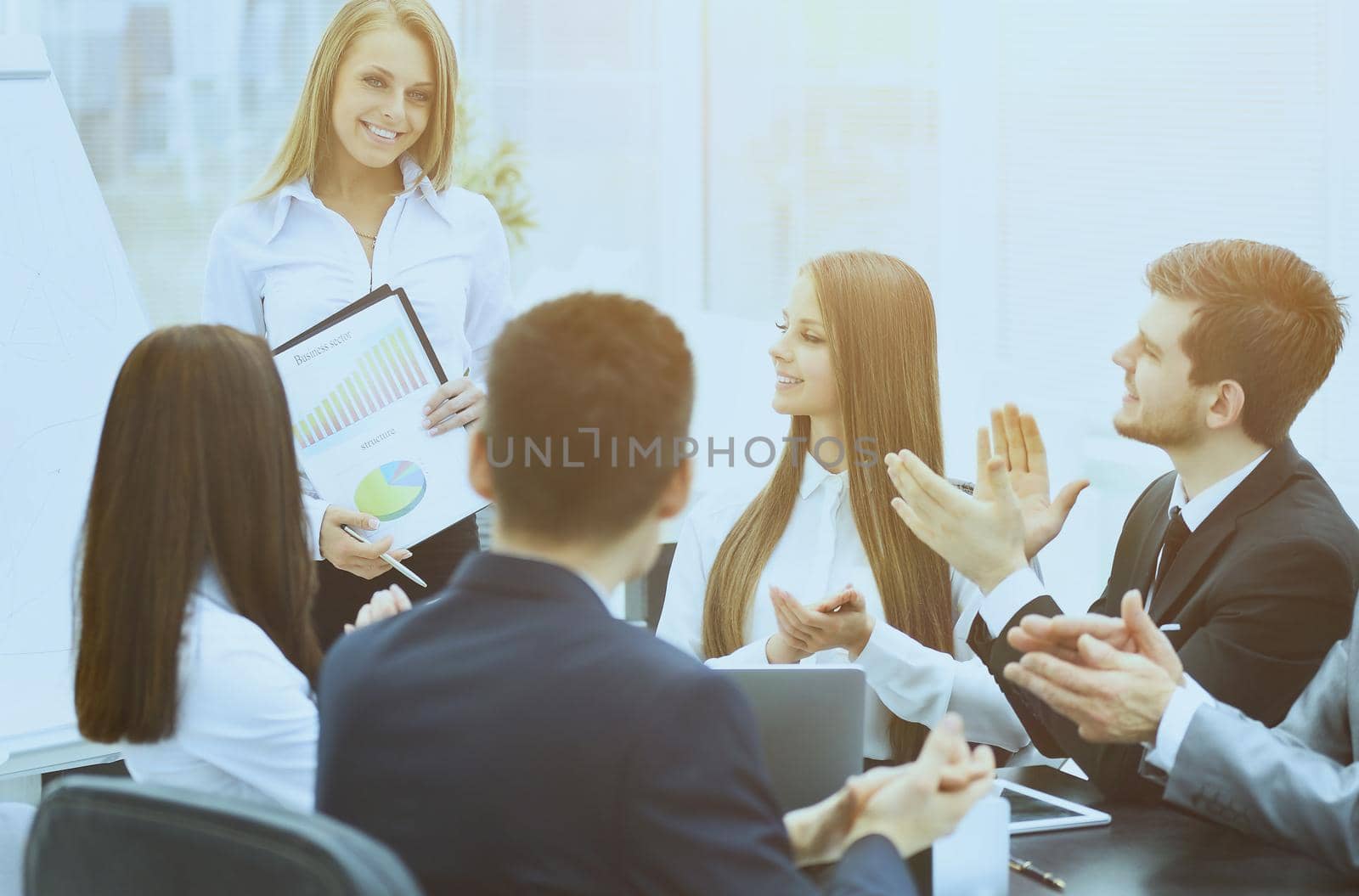 business woman with a successful business presentation in a modern office with colleagues oplodismentami on business in a modern office