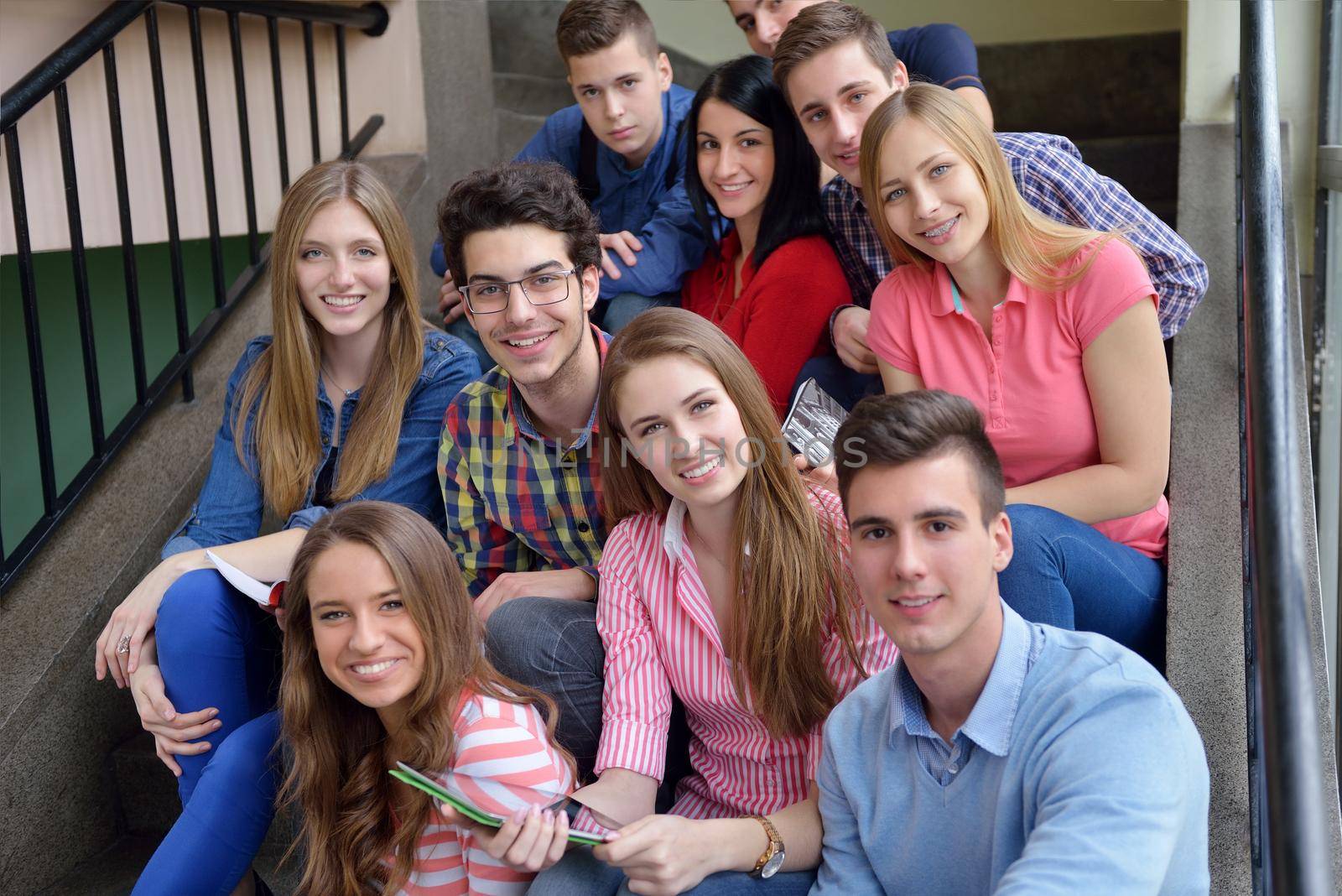 happy teens group in school by dotshock