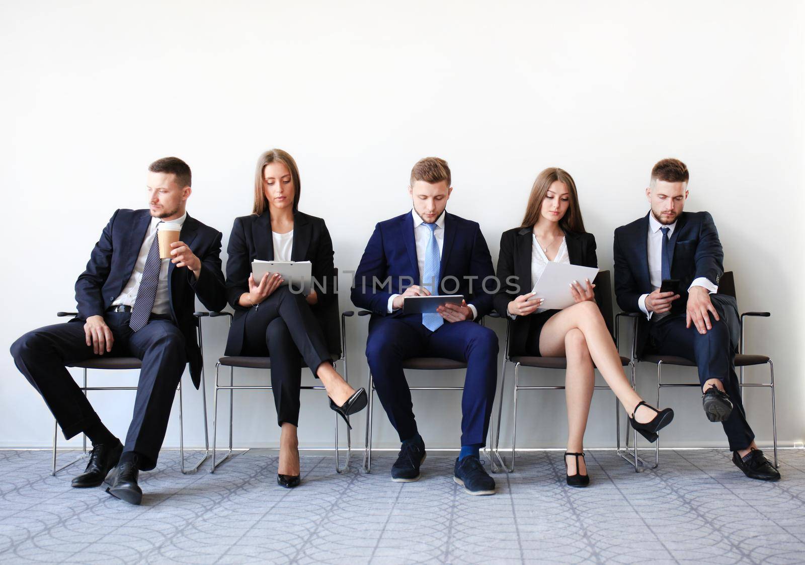 Stressful people waiting for job interview by tsyhun