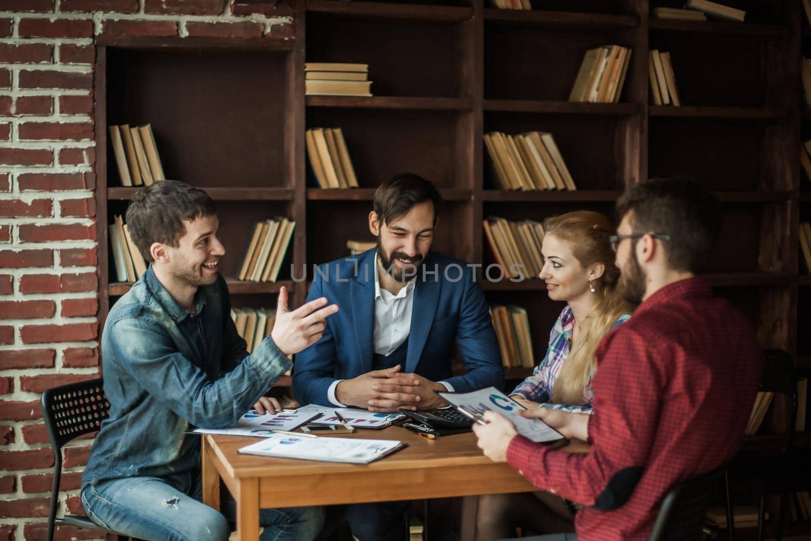 successful business team discussing a financial report on the company's profits in the workplace in the office