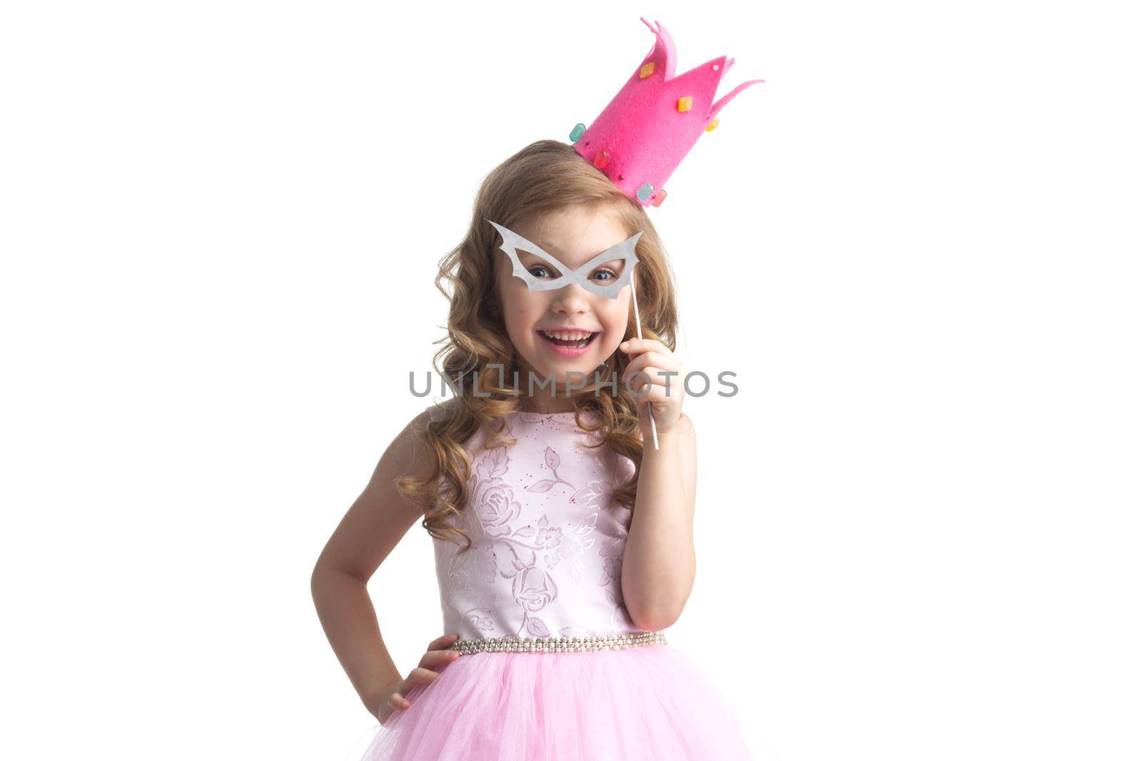 Funny princess girl in pink dress and crown holding party glasses on stick isolated on white background