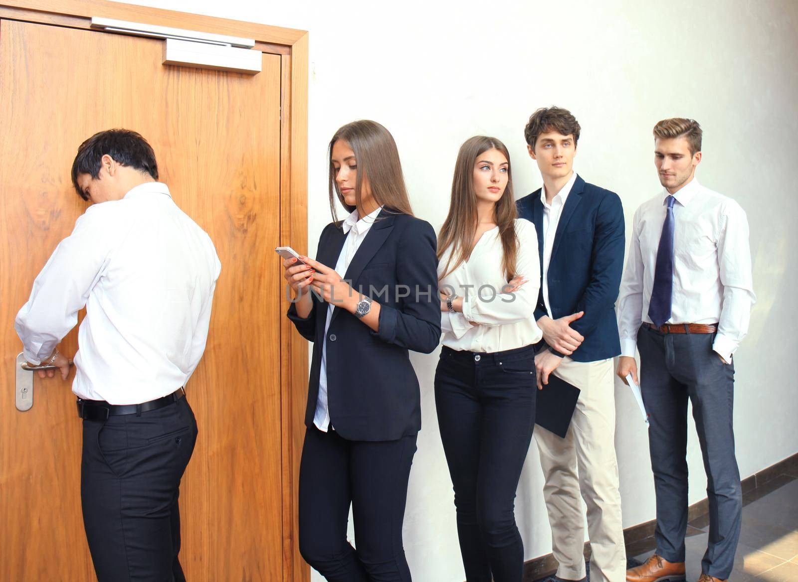 Business people waiting for job interview by tsyhun