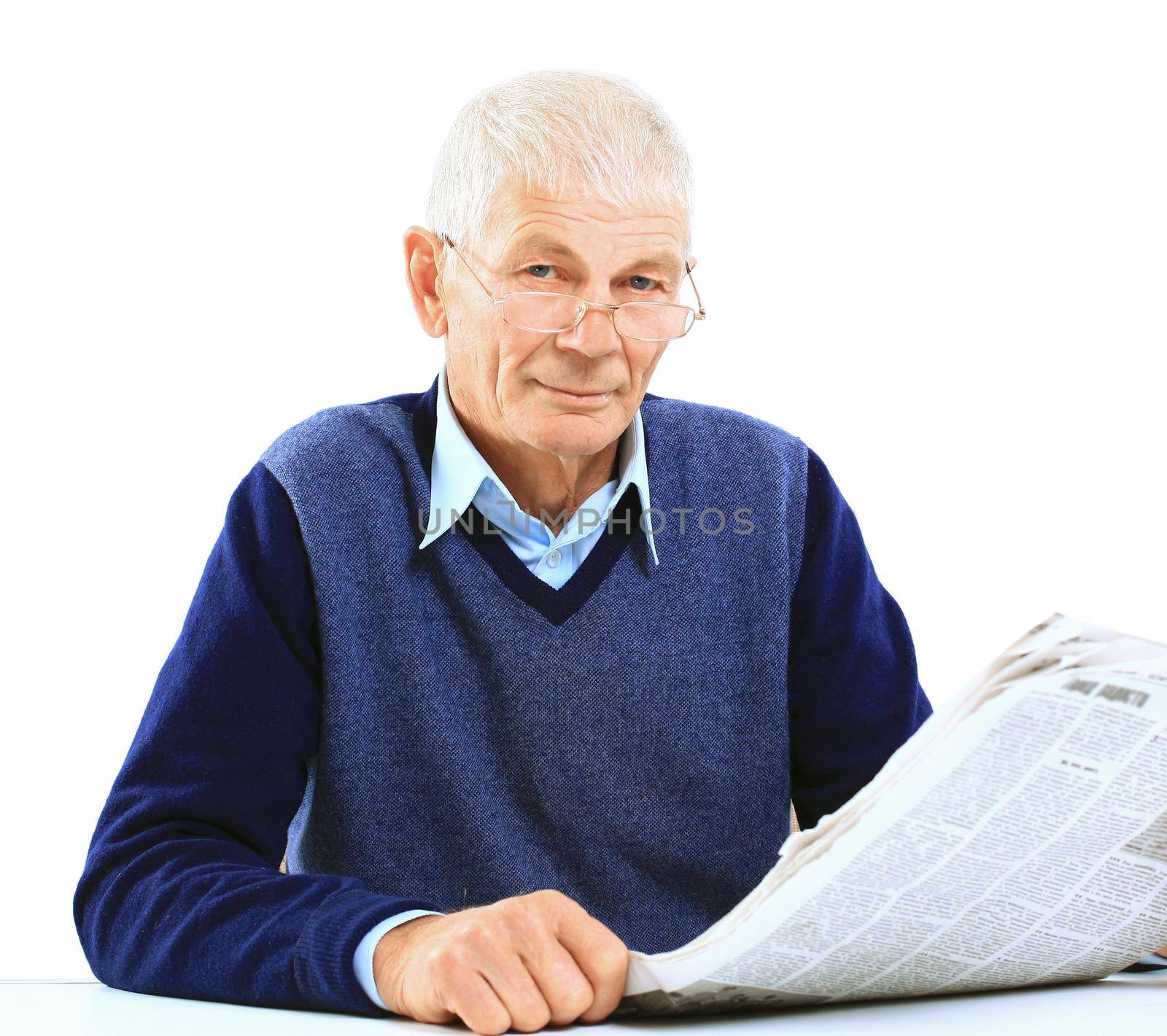 Portrait of an old man solving crosswords in the newspaper by tsyhun