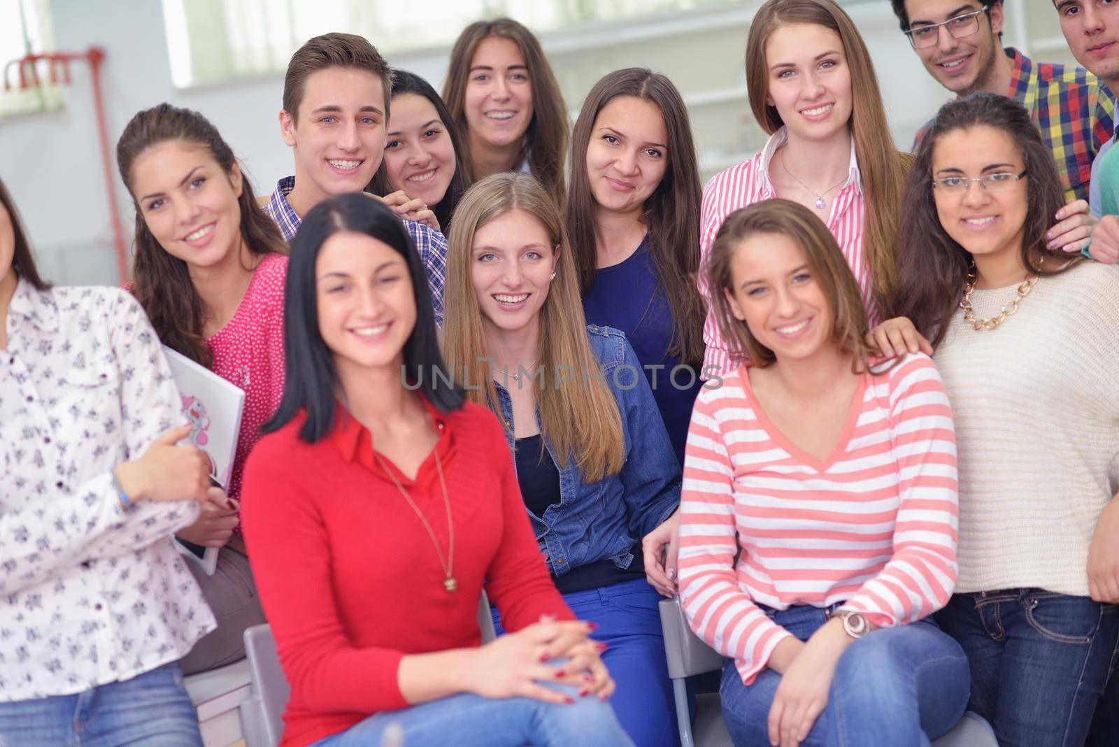happy teens group in school by dotshock
