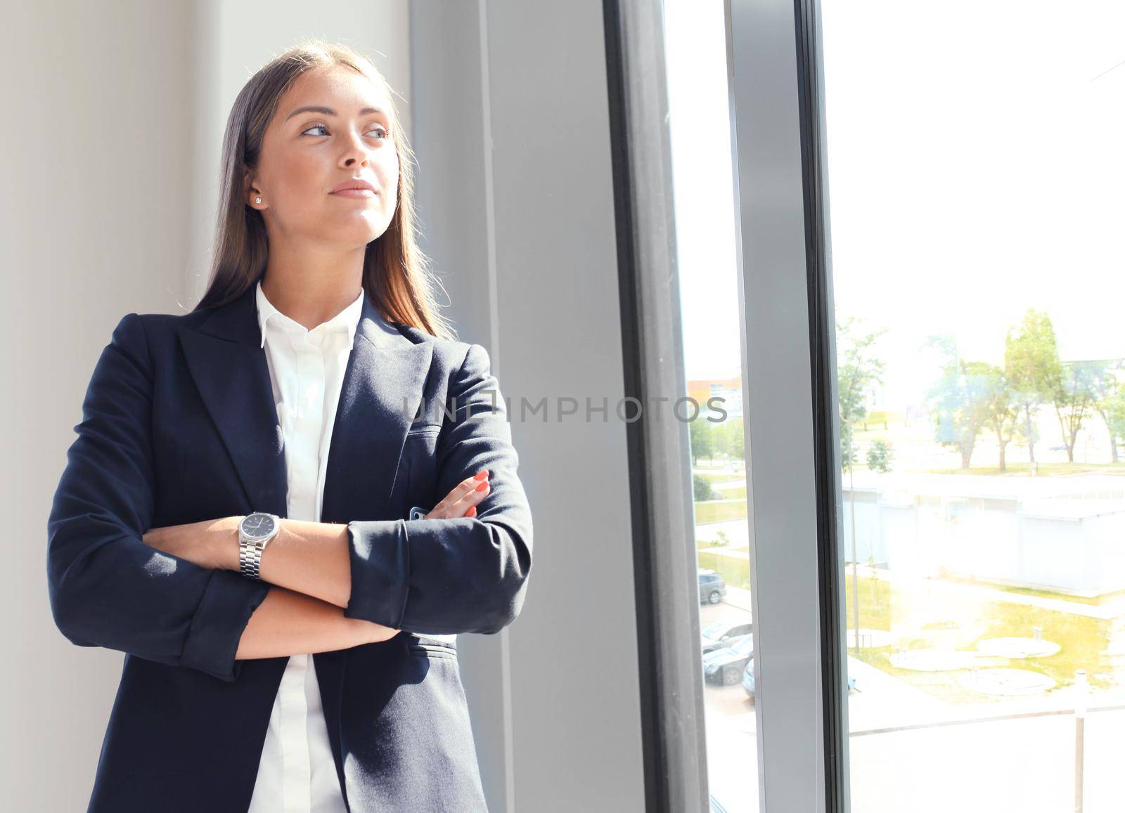 Modern business woman in the office with copy space by tsyhun