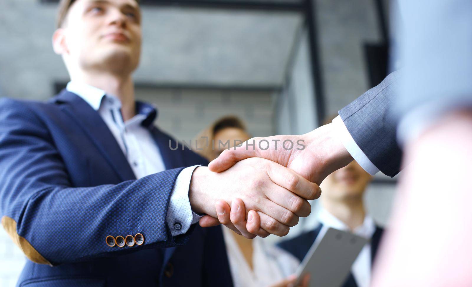 Business handshake. Business people shaking hands, finishing up a meeting