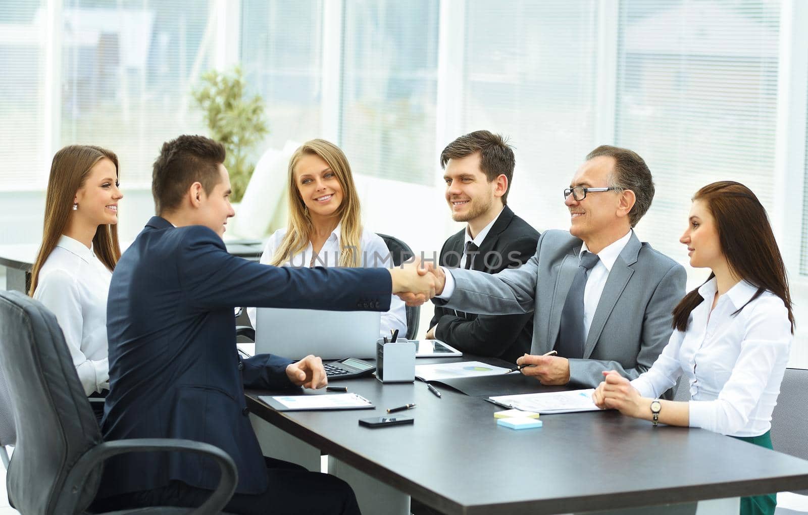 shaking hands during a business meeting business partners in the office