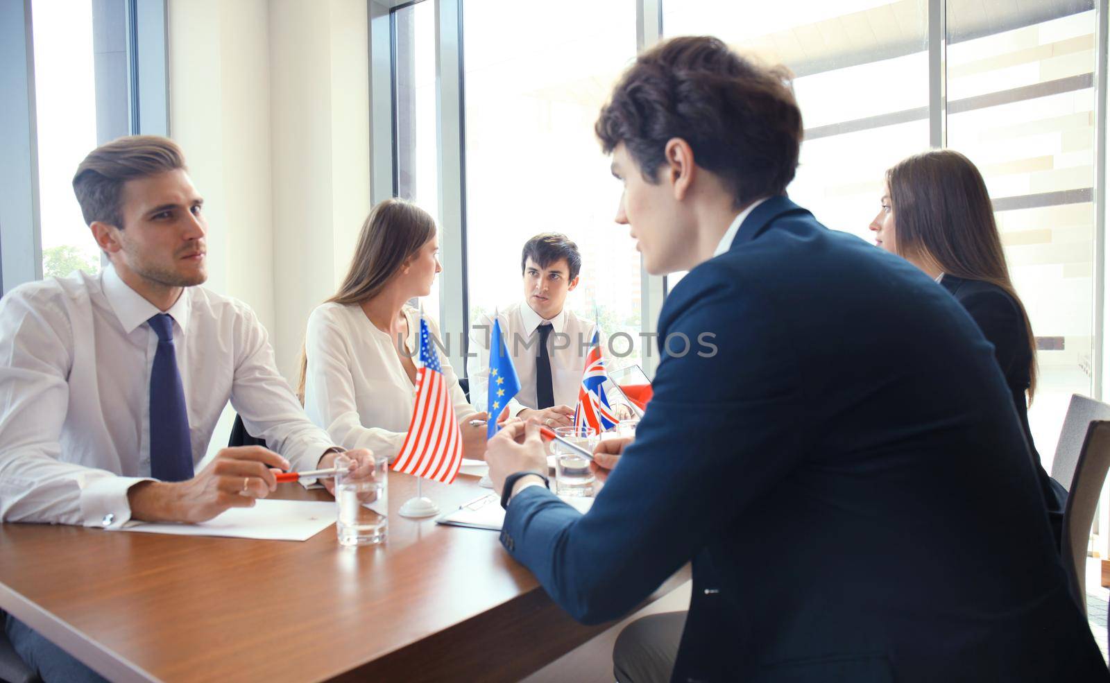 Diversity people talk the international conference partnership. American flag and British flag.