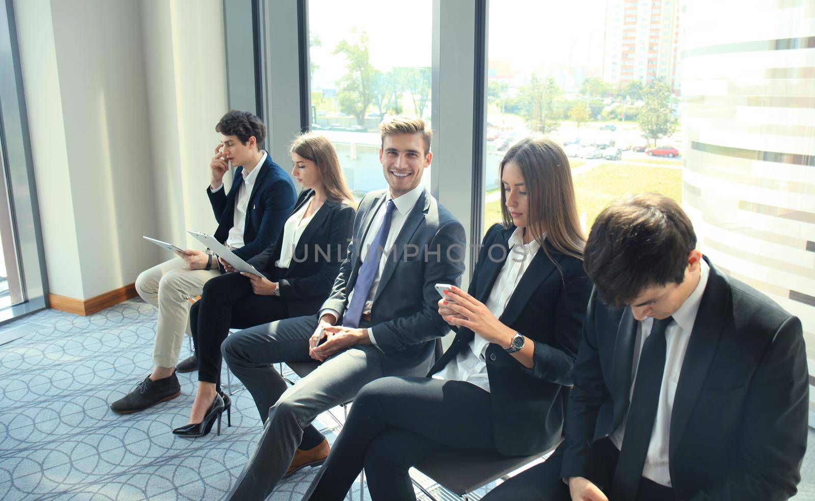 Business people waiting for job interview by tsyhun