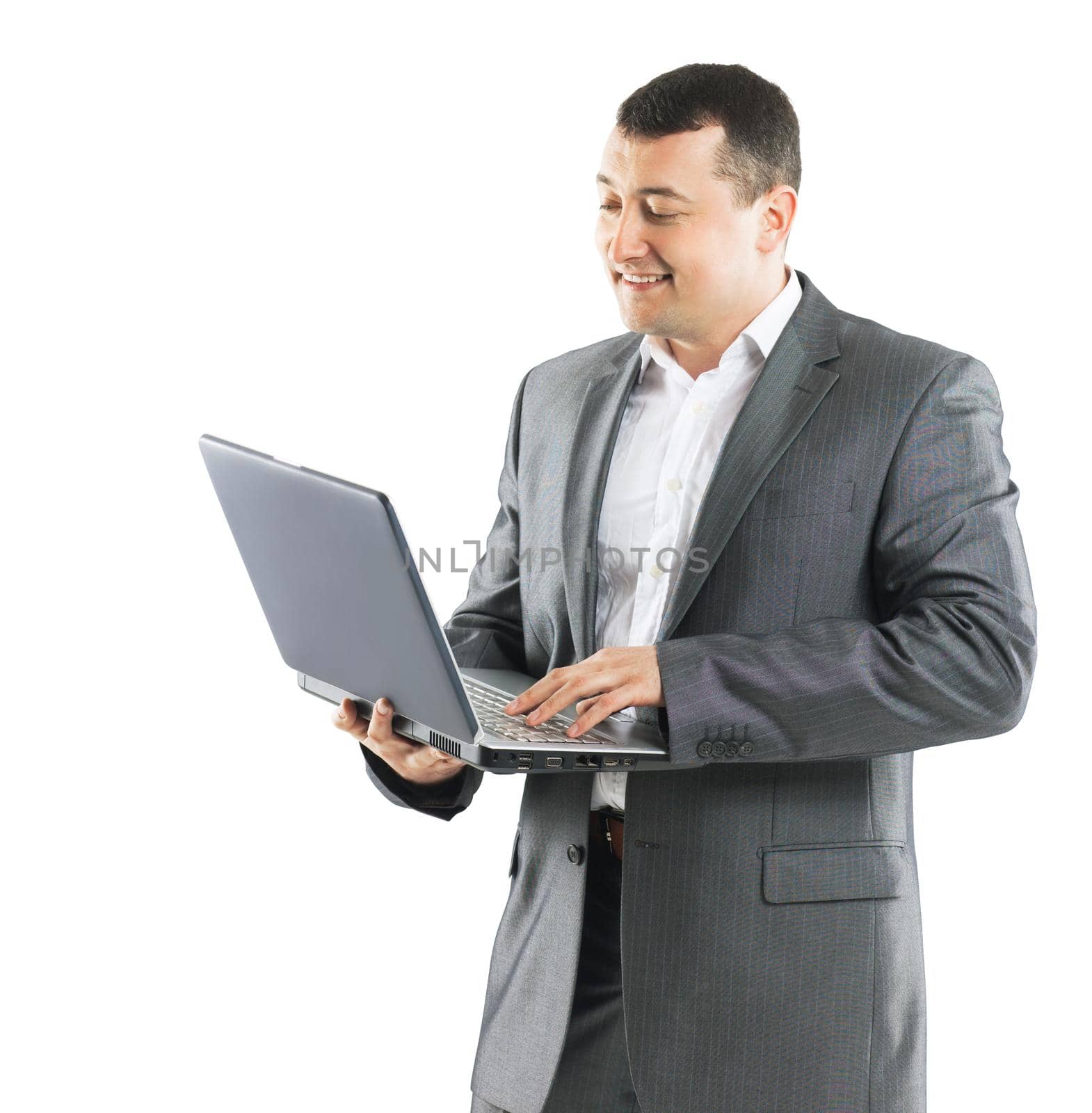 Business man with a laptop on a white background is exploring methods to promote products