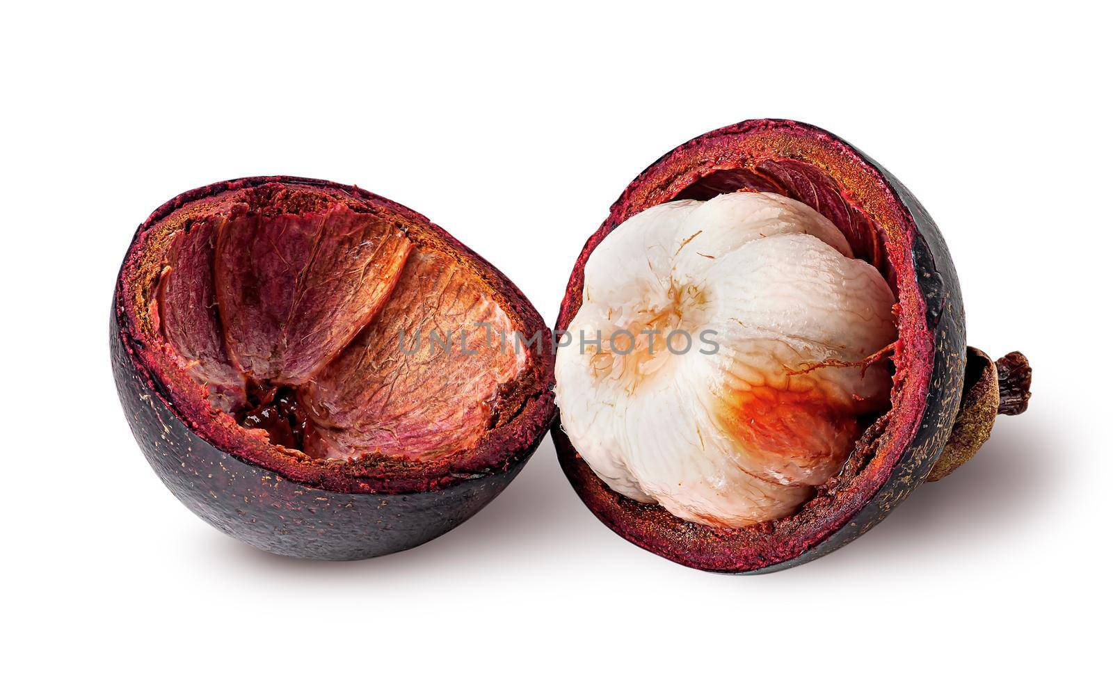 Opened mangosteen and shells near isolated on white background