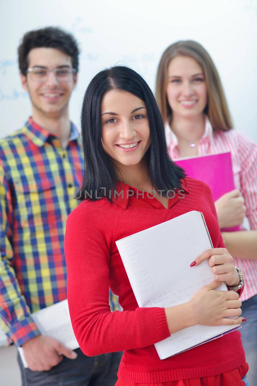 happy teens group in school by dotshock