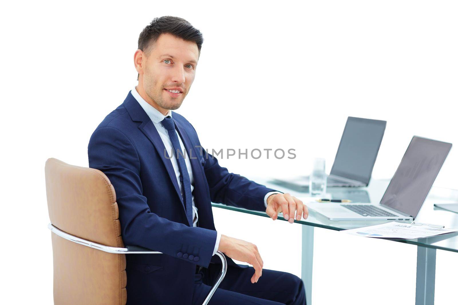 lawyer behind a Desk before an open laptop by SmartPhotoLab