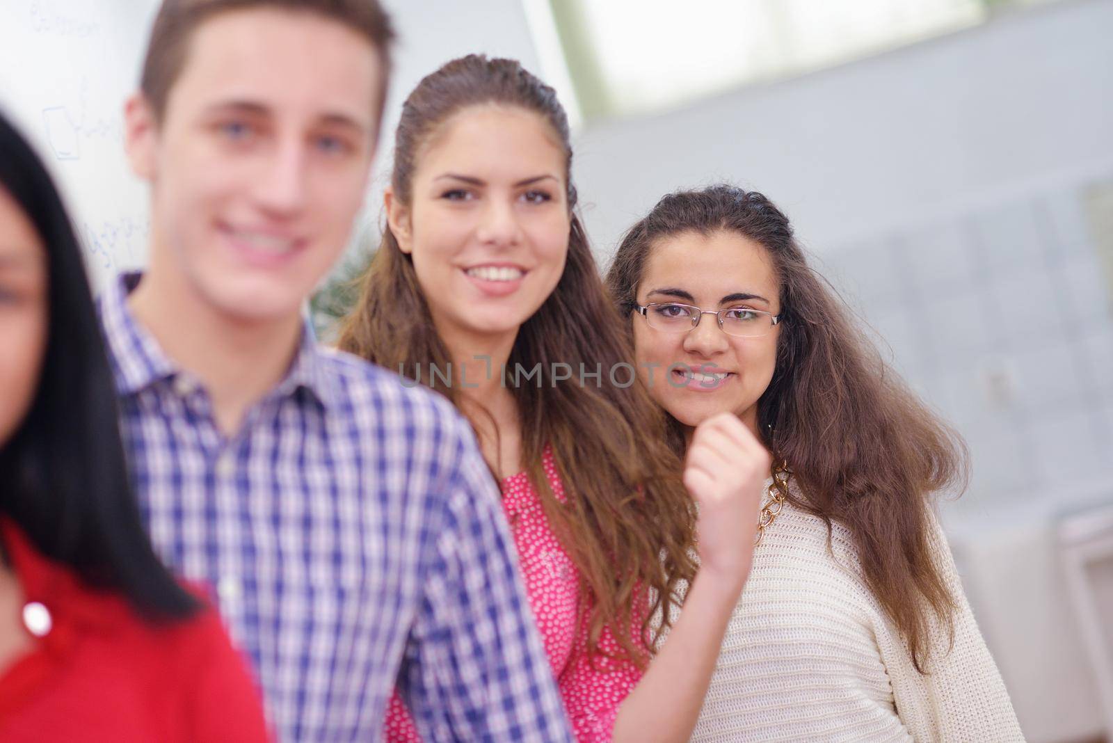 happy teens group in school by dotshock