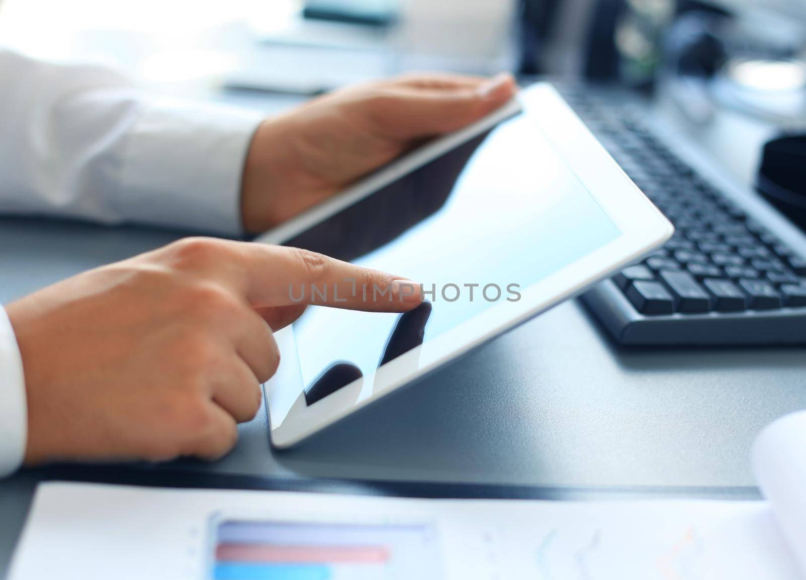 Businessman holding digital tablet by tsyhun