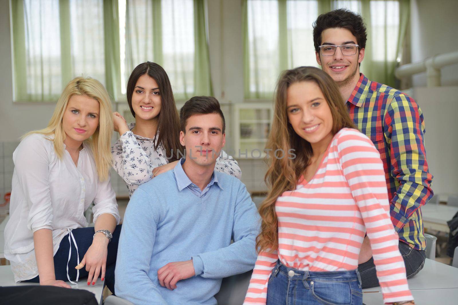 happy teens group in school by dotshock