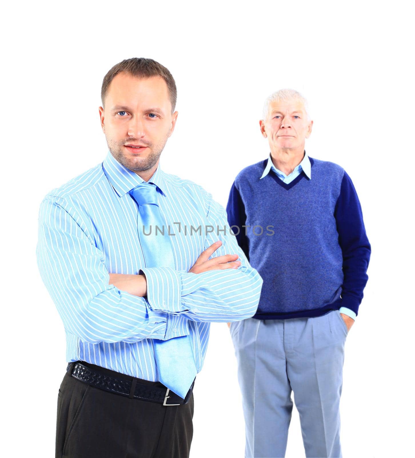 Portrait of a relaxed son standing with his father behind against white background. by tsyhun