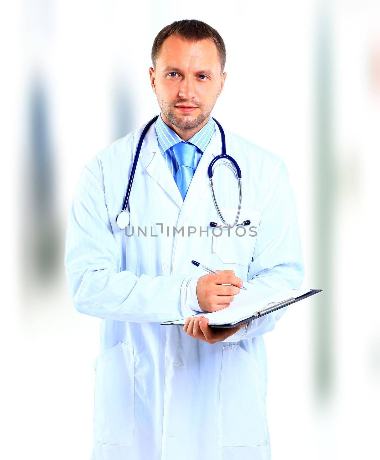 portrait of doctor in white coat and stethoscope with arms crossed by tsyhun