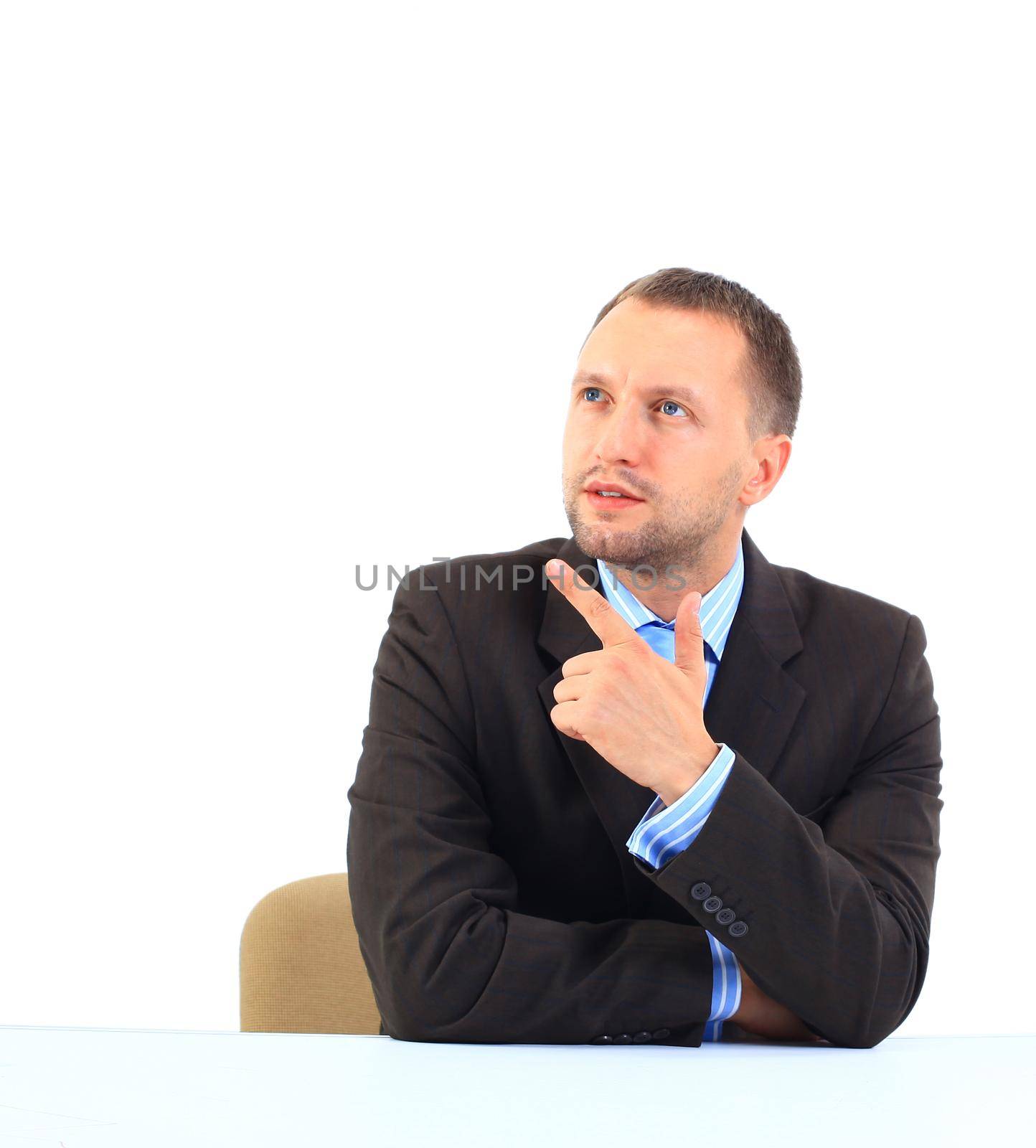 Portrait of an handsome businessman looking and pointing his finger up