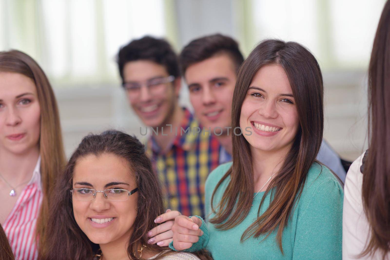 happy teens group in school by dotshock