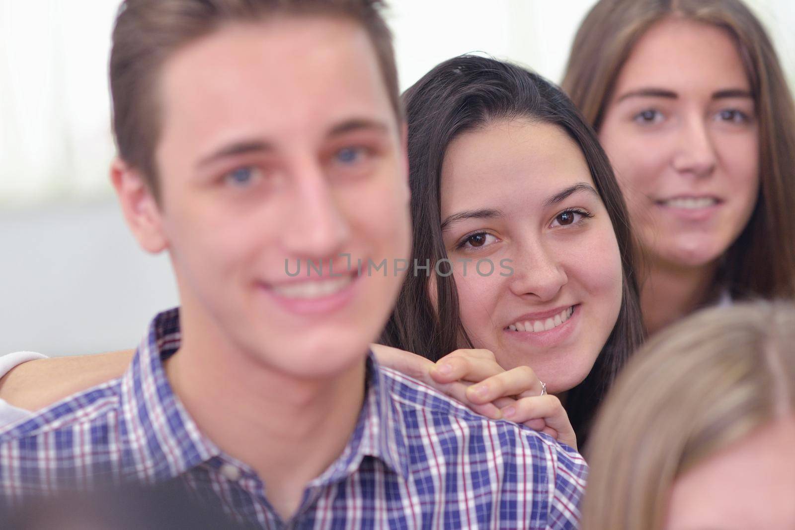 happy teens group in school by dotshock