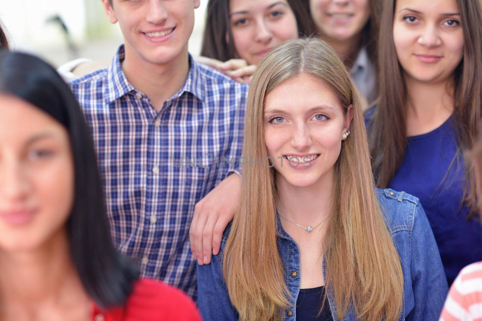 happy teens group in school by dotshock