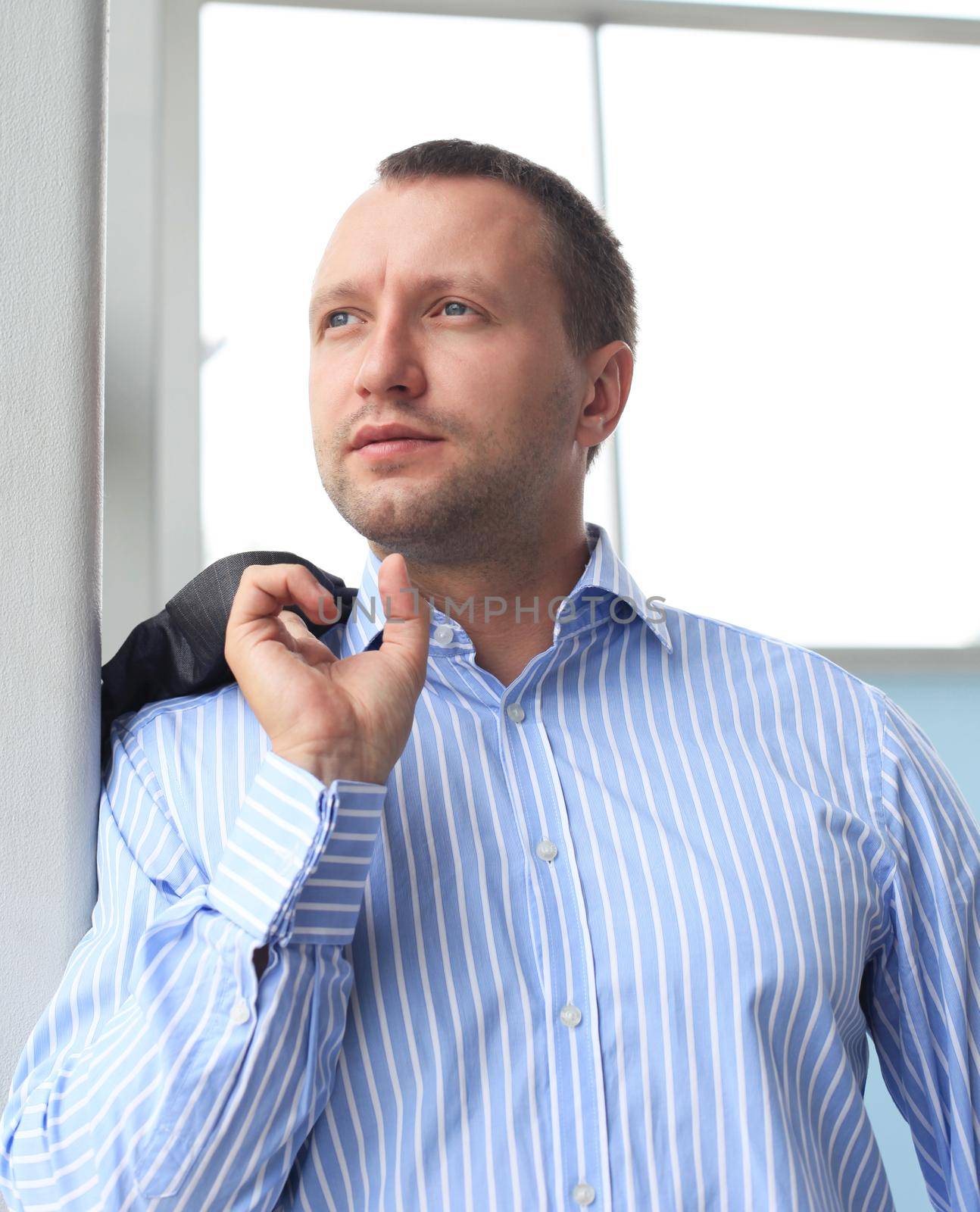 Portrait of a businessman looking at the window