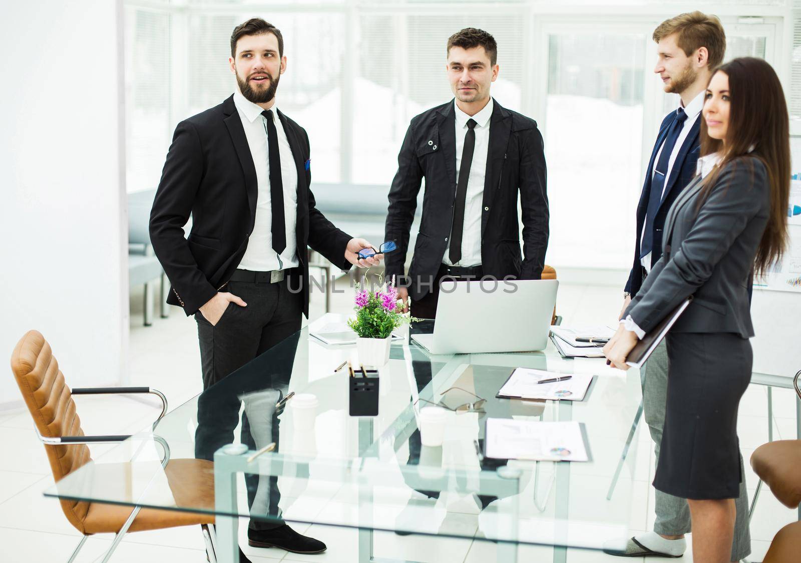 Manager and business team standing near the desktop before the meeting.the photo has a empty space for your text