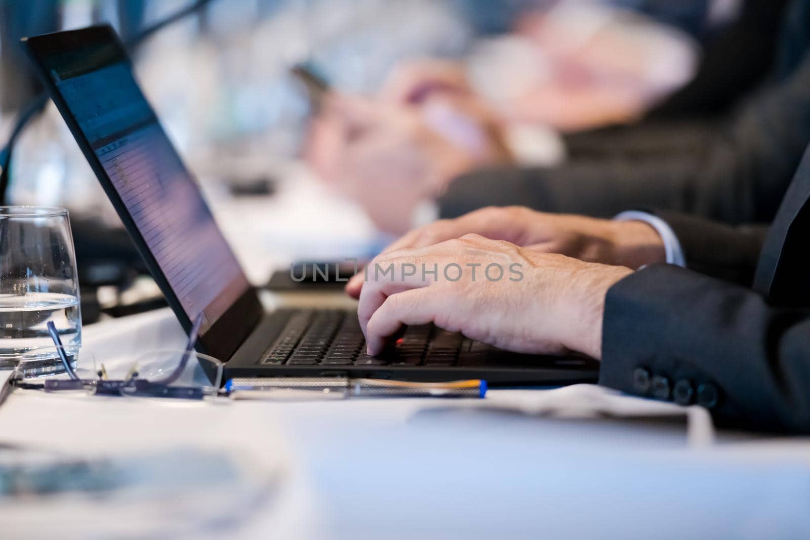 close up of business people hands using laptop computer by dotshock