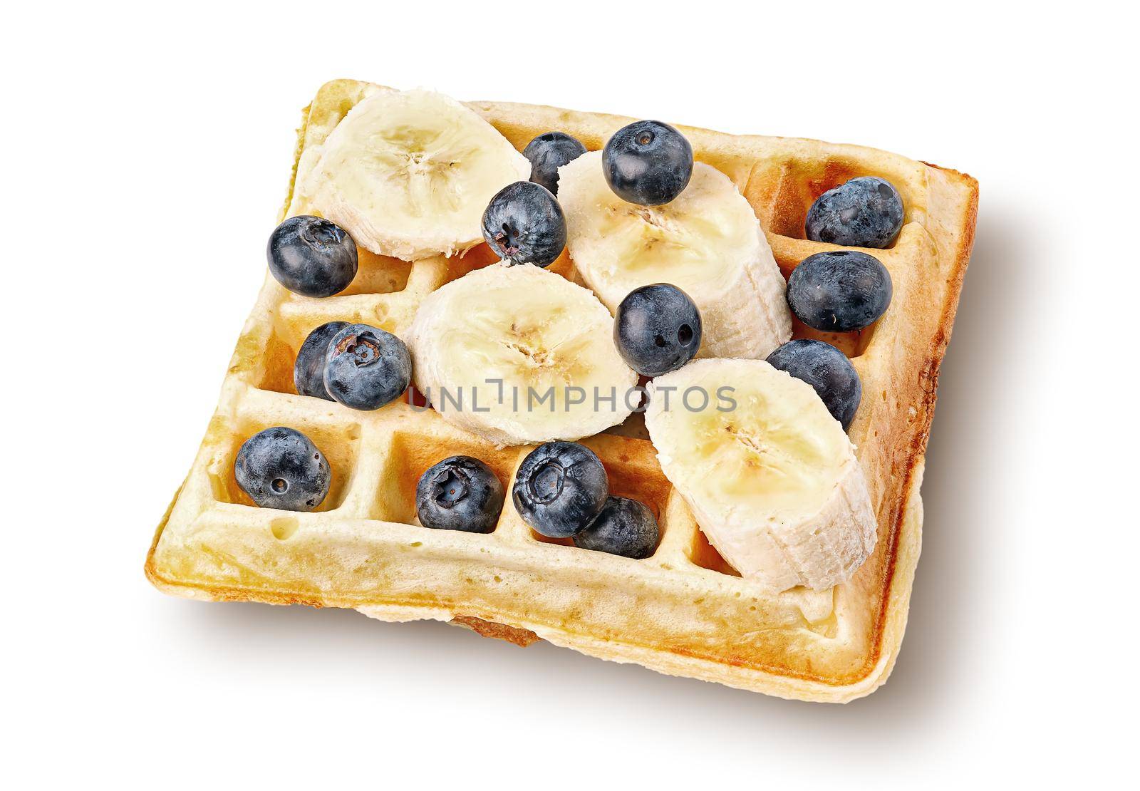 French waffles with blueberries and bananas top wiev isolated on white background