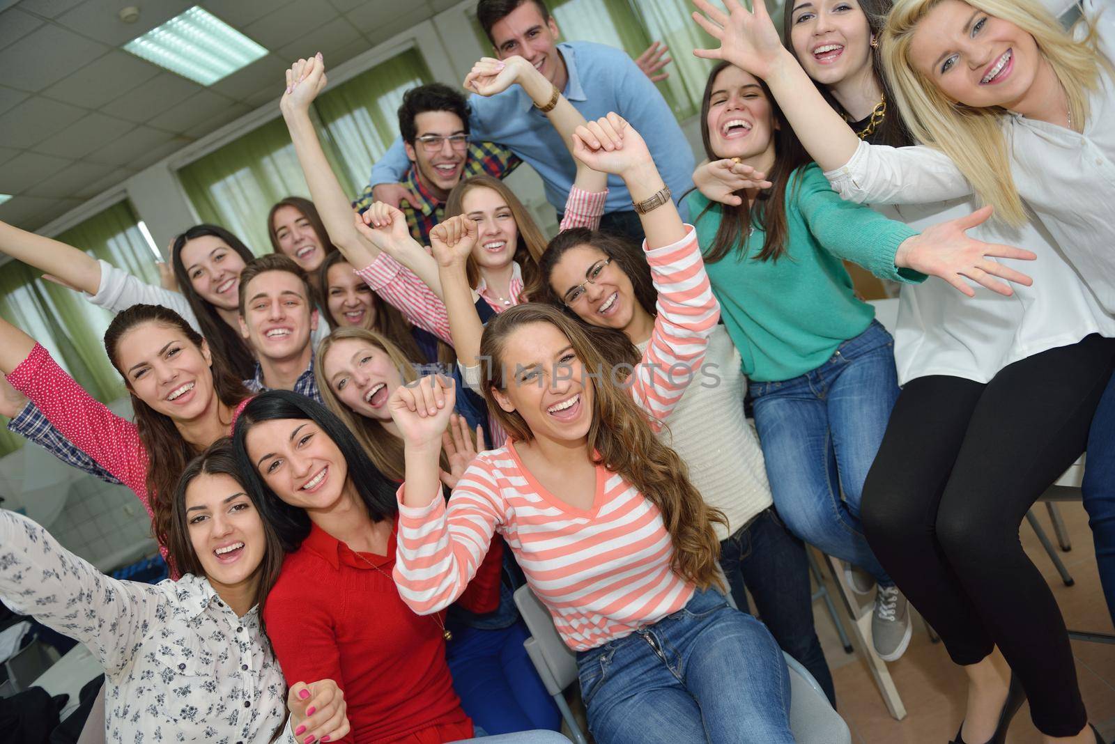 happy teens group in school by dotshock