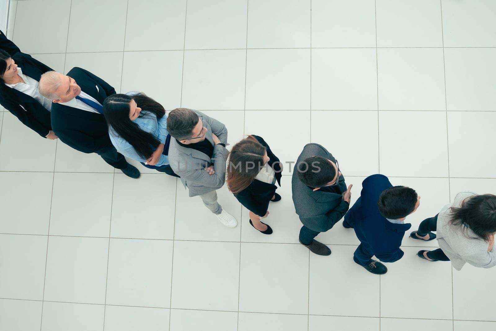 group of diverse business people standing in line by SmartPhotoLab