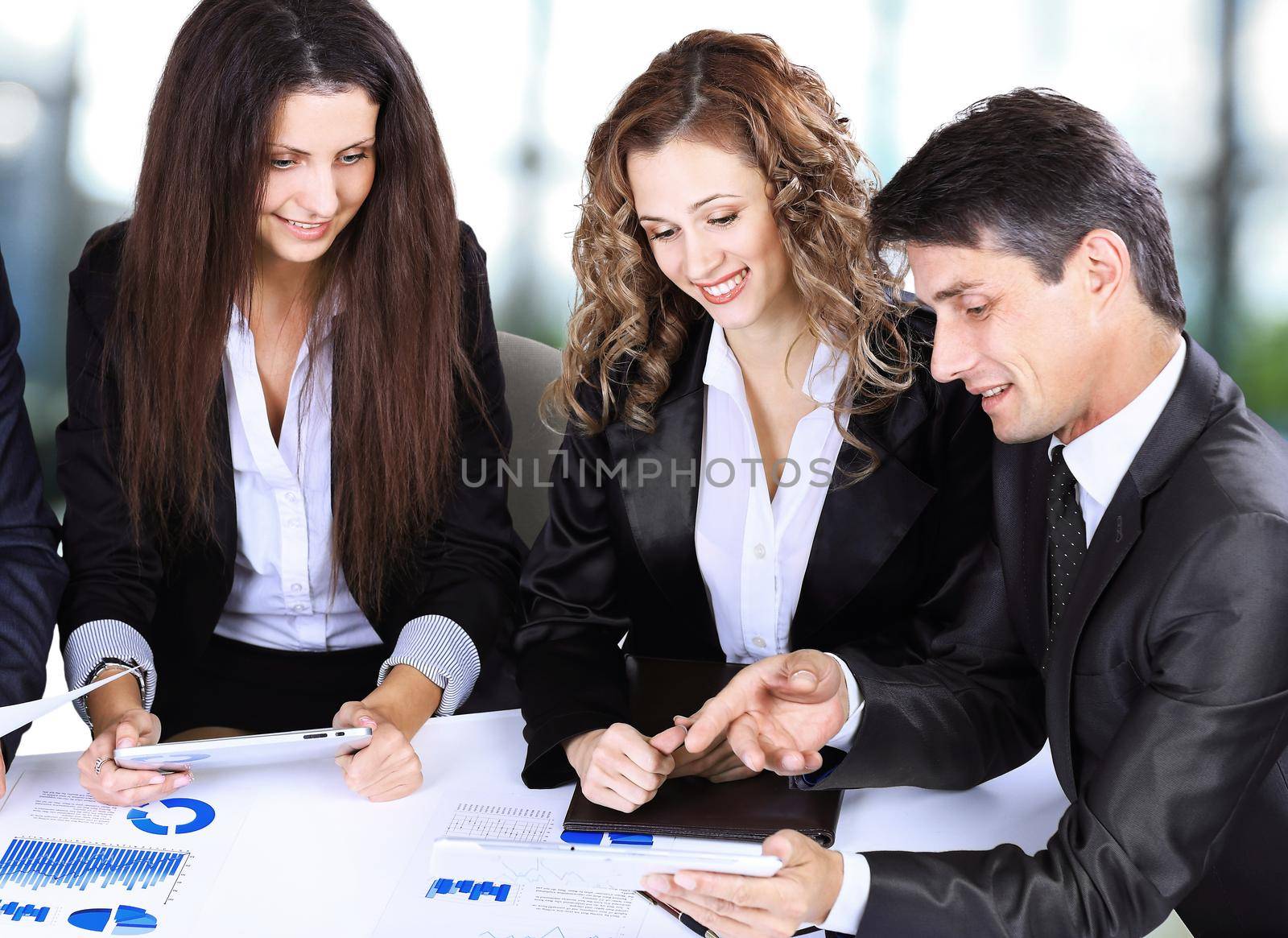 business, technology and office concept - smiling female boss talking to business team