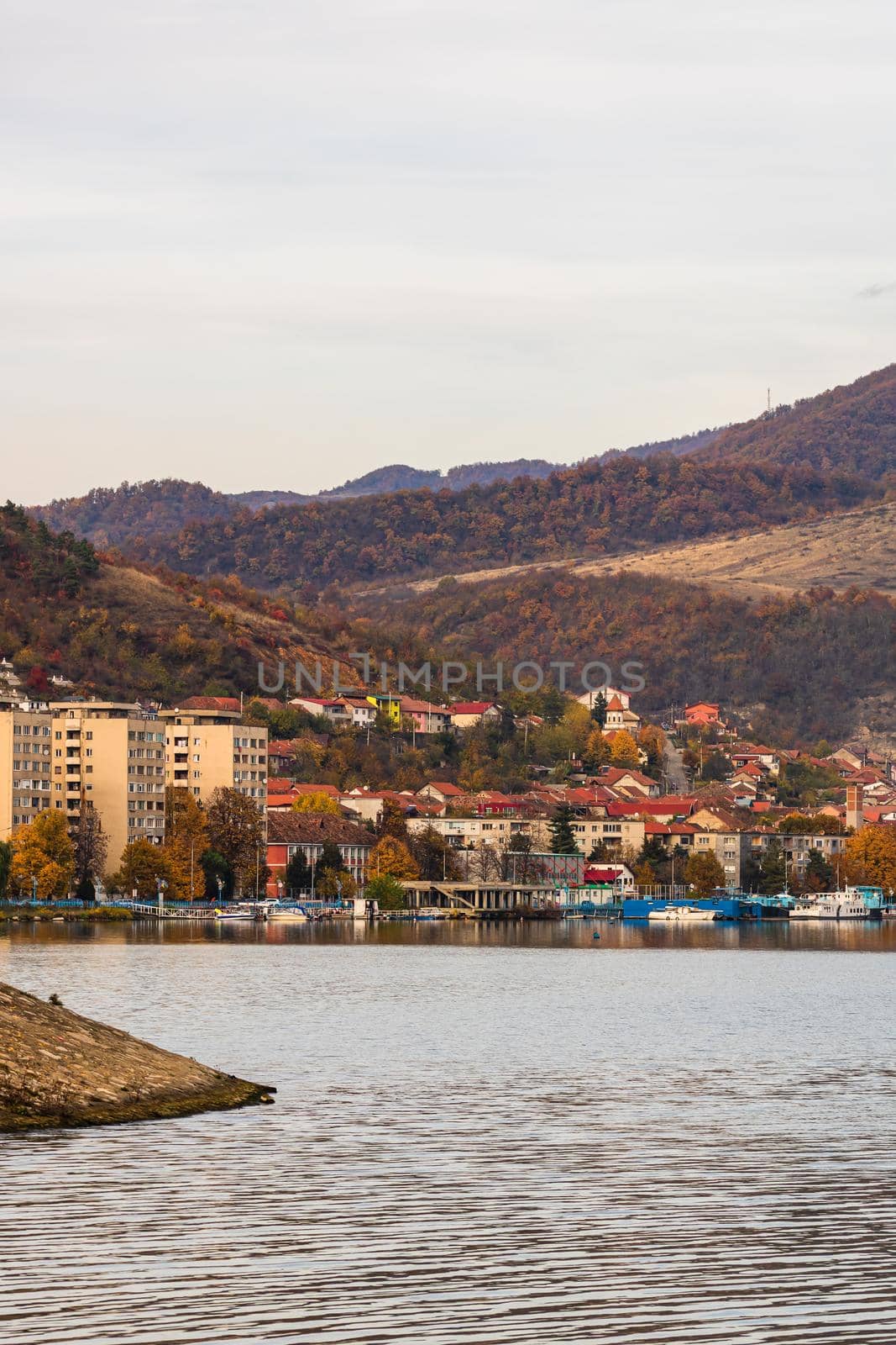 View of Danube river and Orsova city vegetation and buildings, waterfront view. Orsova, Romania, 2021 by vladispas