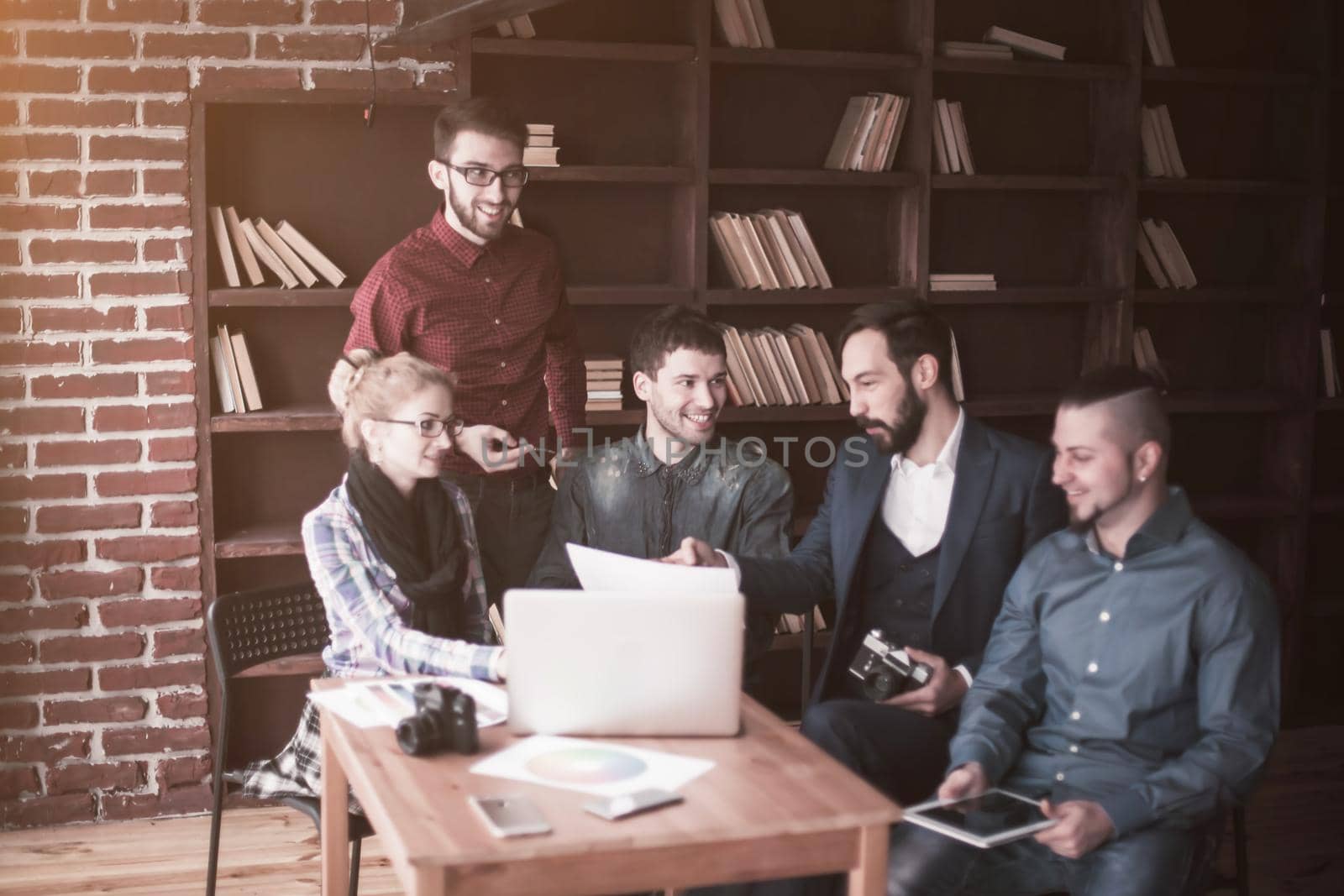 positive creative team of copywriters in the workplace in a modern office