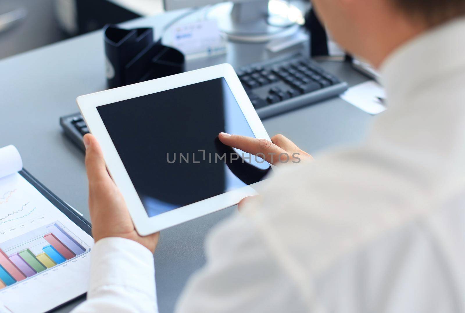 Businessman holding digital tablet